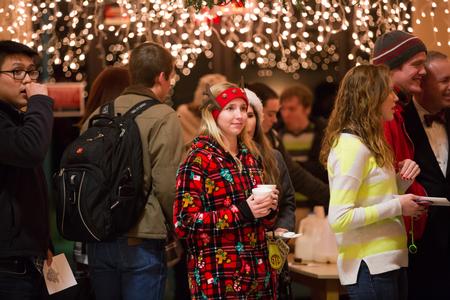 Students get settled in McAfee Commons with their cookies and hot chocolate before the annual Christmas with the Olivers event. - Photo by Kristi McMurry Woody