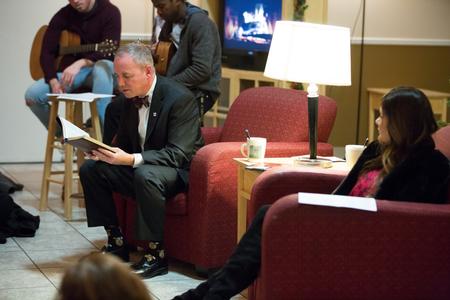 Dub Oliver, president of the university, reads from the Bible during Christmas with the Olivers.  - Photo by Kristi McMurry Woody