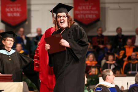 MacKenzie Castellaw, business administration graduate, celebrates receiving her diploma during fall graduation. - Photo by Kristi McMurry Woody