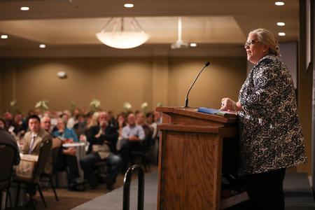 Nancy Cherry, teaching and learning chair, introduces HK Derryberry and Jim Bradford for the EDGE Program fundraising banquet.  - Photo by Kristi McMurry Woody