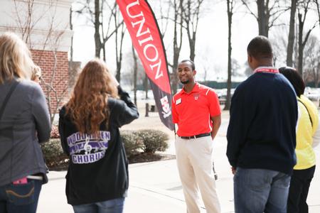 Jonathan Boyd, enrollment counselor, gives a tour during Day at the U. - Photo by Kristi McMurry Woody