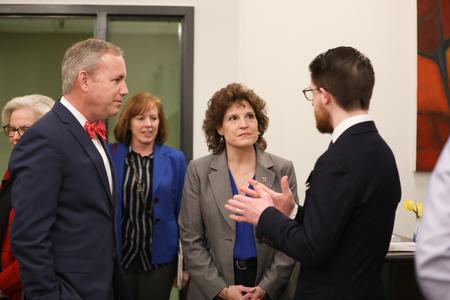 Dub Oliver, president of the university, Lisa Rogers, chair of the board of trustees, and Aaron Beasley, assistant director of the writing center, chat before the official grand opening of the new writing center. - Photo by Kristi McMurry Woody