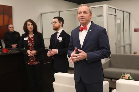 Dub Oliver, president of the university, welcomes guests to the grand opening of the new writing center.  - Photo by Kristi McMurry Woody