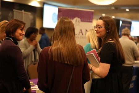 Students mingle with representatives from area businesses to build connections during the annual College to Career event hosted by the Vocatio Center.  - Photo by Kristi McMurry Woody