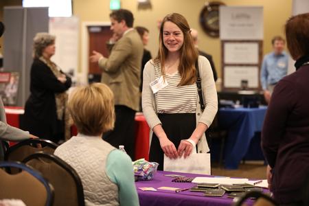 Amanda Leatherwood, physical education and health major, meets reps from area businesses during the College to Career fair hosted by the Vocatio Center, - Photo by Kristi McMurry Woody