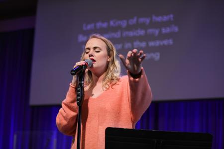 Corinne Olund, public relations major, sings in chapel. - Photo by Kristi McMurry Woody