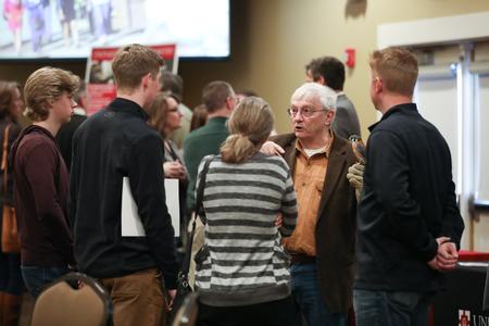 James Huggins, university professor of biology, chats with prospective students about the biology department during Day at the U. - Photo by Kristi McMurry Woody