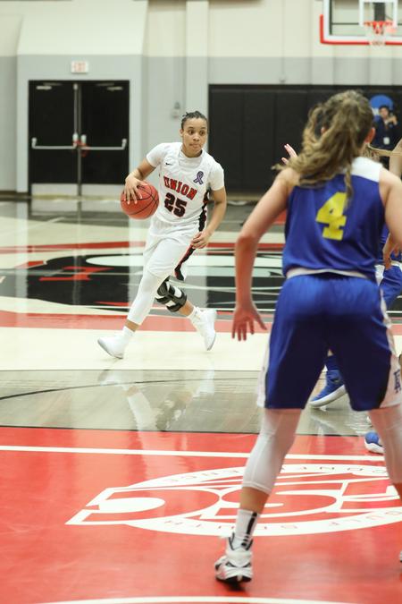 Chelsey Shumpert dribbles down the court in a tournament game against Embry-Riddle University. - Photo by Kristi McMurry Woody