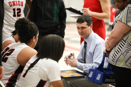 Mark Campbell, head women's basketball coach, talks to his players during a time-out.  - Photo by Kristi McMurry Woody