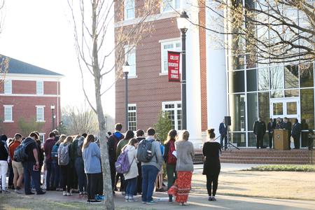 Guests gather in front of The Logos to honor Martin Luther King Jr. on the 50th anniversary of his death. - Photo by Kristi McMurry Woody