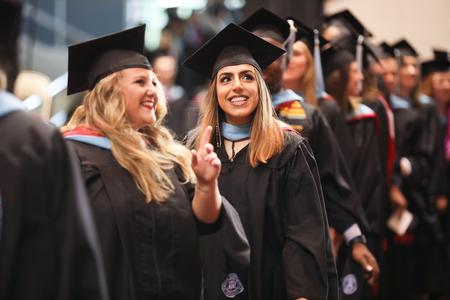 Students process into the Oman Arena for spring commencement services.  - Photo by Kristi McMurry Woody