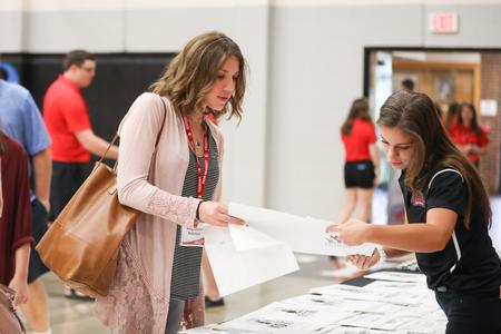 Maggie Bollinger, new student in the class of 2022, checks in for move-in day in the Fred Delay Gym. - Photo by Kristi McMurry Woody