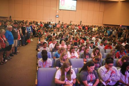 New students sit in the center section of chapel while family and Union employees surround them and prayer for them during the Welcome Week blessing chapel. - Photo by Kristi McMurry Woody