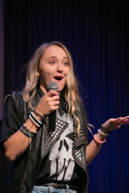 Ali Butler, interdisciplinary studies major, lip syncs at the Welcome Week show. - Photo by Hannah Heckart