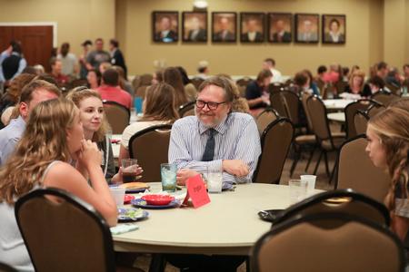 David Malone, associate professor of English and department chair, chats with new English majors during Welcome Week. - Photo by Kristi McMurry Woody