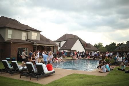 Students enjoy the ice cream social at the president's house during Welcome Week. - Photo by Kristi McMurry Woody