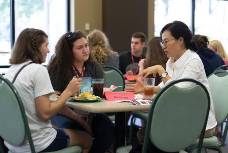 Esther Choi (right), assistant professor of biology, talks with new biology students during Welcome Week. - Photo by Joey Echeverria