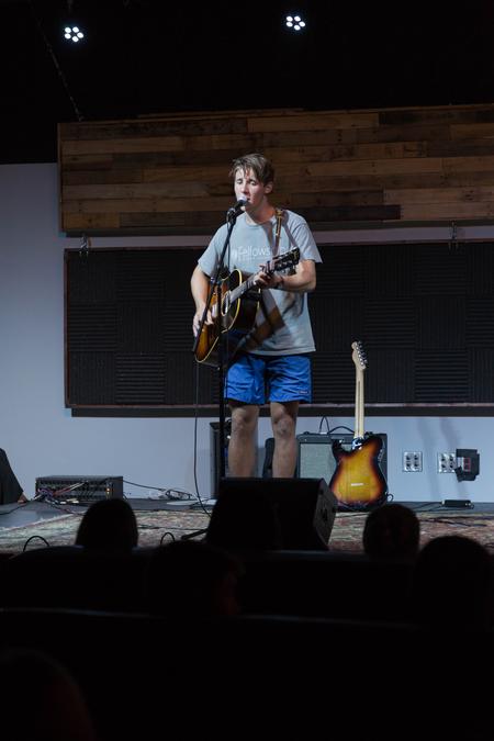Braden Donnell, new student, performs during Welcome Week open mic night. - Photo by Riley Boggs