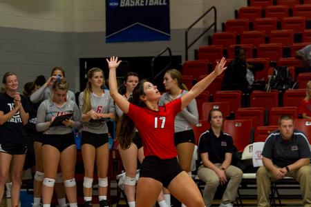 Anna Claire Winchester, sophomore, serves the ball in a volleyball game against Belmont Abbey College. - Photo by Nikki Grim