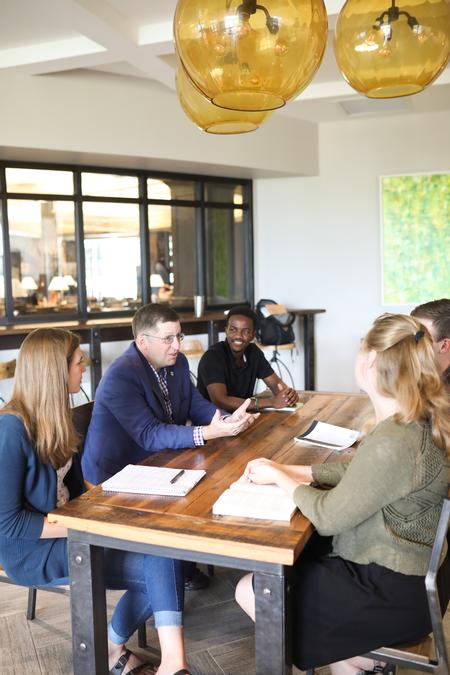 Ray Van Neste, dean of the school of theology and missions, talks with students in Modero. - Photo by Kristi McMurry Woody