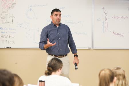 Blake Watkins, professor of pharmaceutical sciences and chair of the department, lectures in Providence Hall.  - Photo by Kristi McMurry Woody