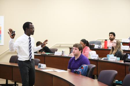 Richard Addo, professor of pharmaceutical sciences, lectures in Providence Hall. - Photo by Kristi McMurry Woody