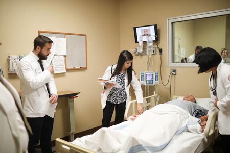 Pharmacy students do assessments in the simulation lab. - Photo by Kristi McMurry Woody