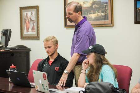 Sean Evans, professor of political science and department chair, talks to students about their next assignment during class.  - Photo by Kristi McMurry Woody