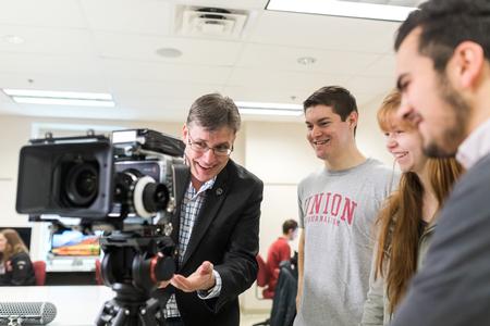 Chris Blair (left), professor of communication arts and coordinator of DMS, shows students some of the university's film equipment. - Photo by Kristi McMurry Woody