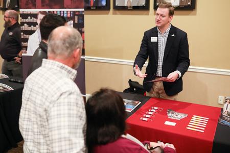 Stephen Hauss, director for pharmacy admissions and recruitment, talks to prospective students and their families during Day at the U. - Photo by Kristi McMurry Woody