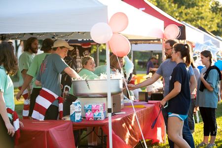 Student Activities Council hands out free cotton candy to guests of Family Weekend Union Night.  - Photo by Kristi McMurry Woody