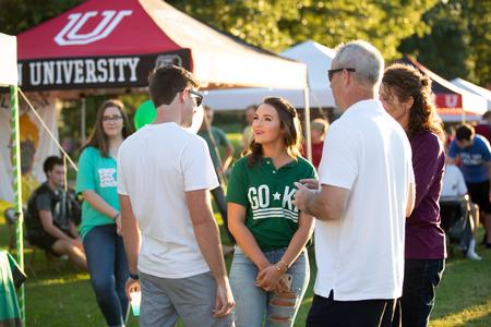 Lauren Blodgett, business administration major, talks to families during Family Weekend Union Night.  - Photo by Kristi McMurry Woody