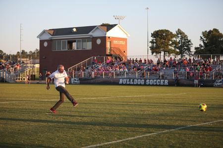 Dub Oliver, president of the university, participates in a half-time faculty and staff shoot-out during the Community Appreciation Event hosted by Undergraduate Admissions. - Photo by Kristi McMurry Woody