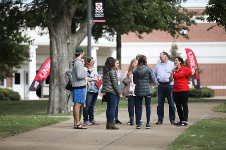Marianne Rivera, business administration major, leads a tour group of prospective students and their families during Bulldog Days.  - Photo by Kristi McMurry Woody