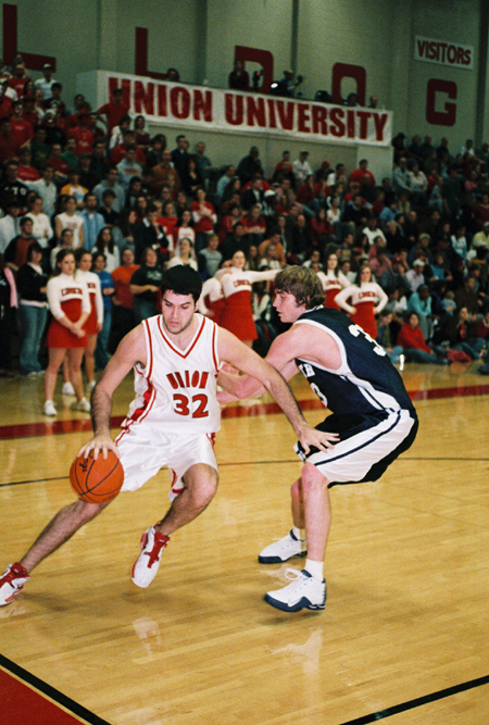 Bruno Martinessi takes a Lambuth player off the dribbe with a loud Union student section behind him. - Photo by Steven Aldridge