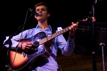 Matthew Steets, senior nursing major, performs at Open Mic in Barefoots Joe.  - Photo by Nikki Grim