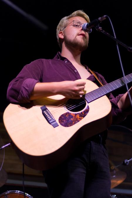 Josh Mays, senior conservation biology major, performs at Open Mic in Barefoots Joe. - Photo by Nikki Grim