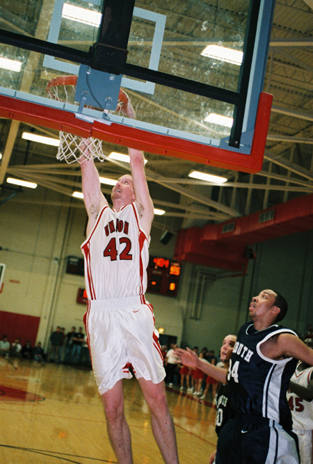 Michael Palmer (42) powers home a dunk during Union's win over Lambuth. - Photo by Steven Aldridge