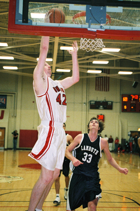 Michael Palmer (42) takes advantage of a fast break layup during Union's win over Lambuth. - Photo by Steven Aldridge