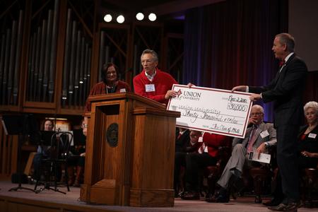 Jerry Drace ('68) presents the class gift from the Class of 1968 during Homecoming Chapel. - Photo by Kristi McMurry Woody