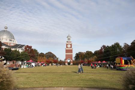 Homecoming guests enjoy the Forever Bulldogs event on the Great Lawn. - Photo by Kristi McMurry Woody
