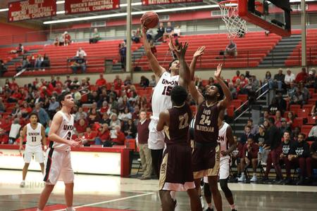 Samory Gueye goes up for a shot during the Homecoming exhibition game against Freed Hardeman University. - Photo by Kristi McMurry Woody