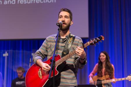 Mack Burns, associate worship leader at Englewood Baptist Church, leads worship during chapel. - Photo by Nikki Grim