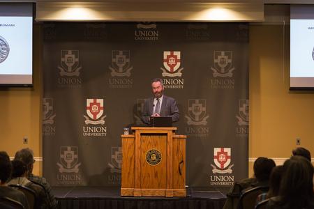 Victor Clark, one of the world's foremost experts on the coinage of Constantine, gives a lecture in the Grant Center.  - Photo by Riley Boggs
