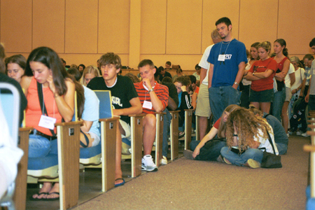 Freshman in prayer during the FOCUS chapel on Sunday morning during New Student Orientation 2002. - Photo by Justin Veneman