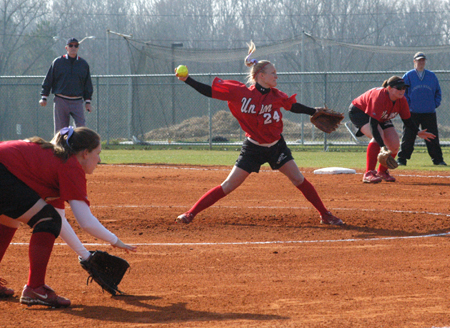 Mary Kosco (24) is delivers a pitch to the plate as Jessica Kee (foreground-3rd base) and Danielle Pope (background-1st base) are ready on defense. - Photo by Steven Aldridge
