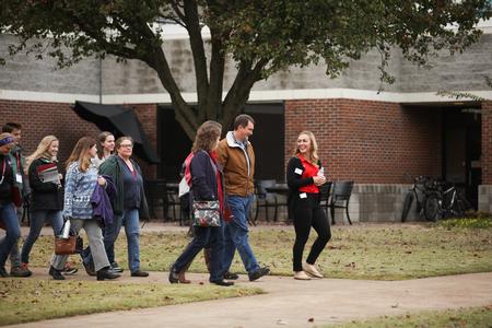 Hannah Daniel, business administration major, leads prospective students on a tour of campus.  - Photo by Kristi McMurry Woody