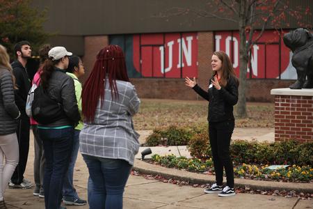 Amanda Leatherwood, physical education and health major, gives a tour of campus during Day at the U. - Photo by Kristi McMurry Woody