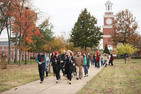 Ashley Cioto, social work major, leads a campus tour for prospective students during Day at the U. - Photo by Kristi McMurry Woody