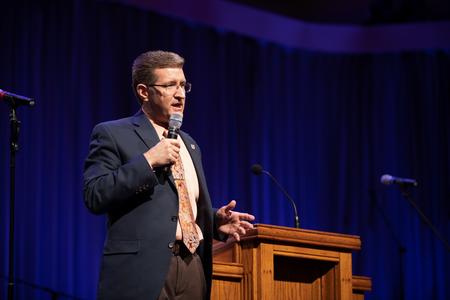 John Kinchen, professor of music and chair of the department, speaks in chapel. - Photo by Kristi McMurry Woody